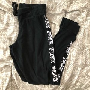 PINK leggings with words printed on the sides